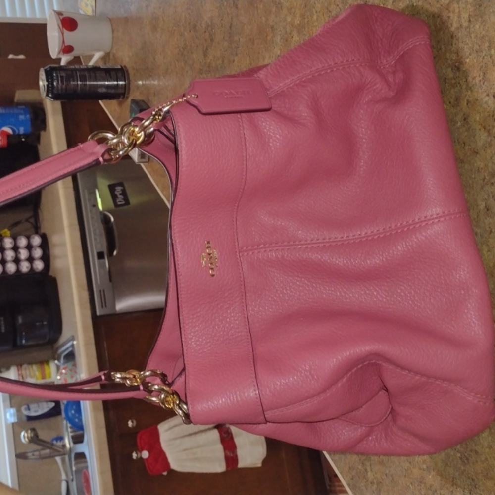 Authentic Coach!!!Light pink Pebbled leather with Gold hardware.